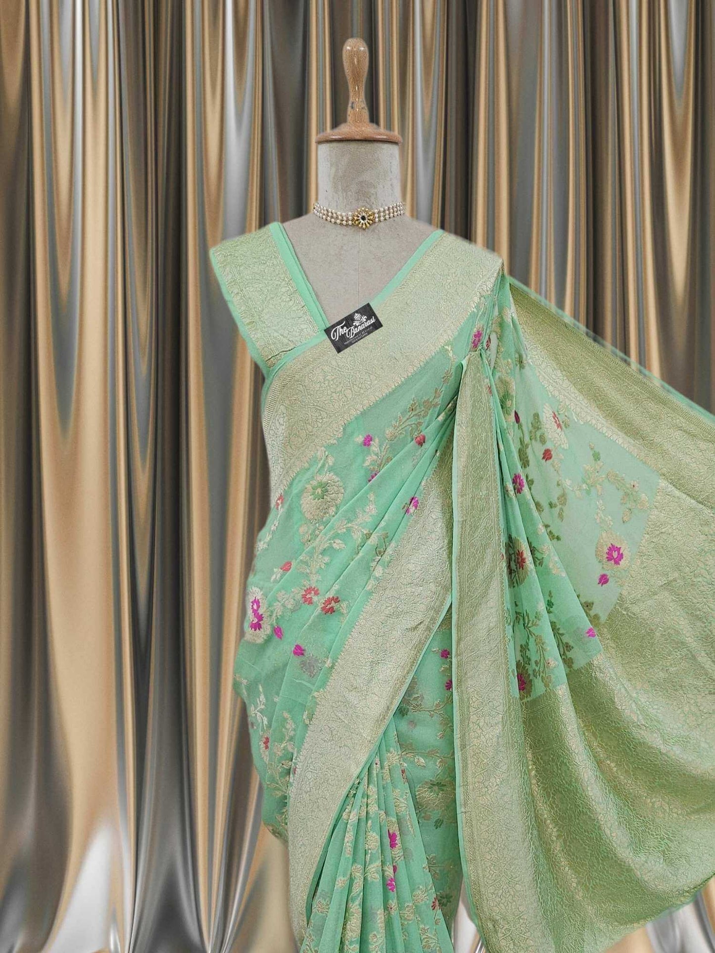 Close-up of Tea Green Handwoven Traditional Khaddi Georgette Banarasi Saree with Meenakari Design