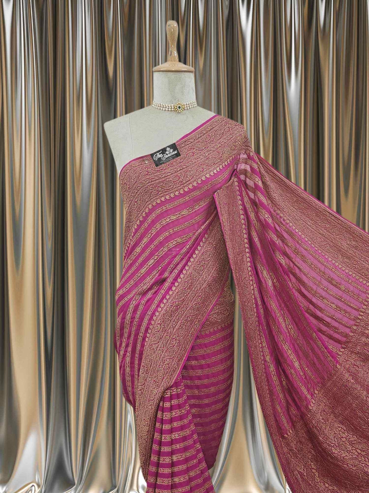 Close-up of Magenta Khaddi Georgette Handwoven Banarasi Saree with Antique Zari Work