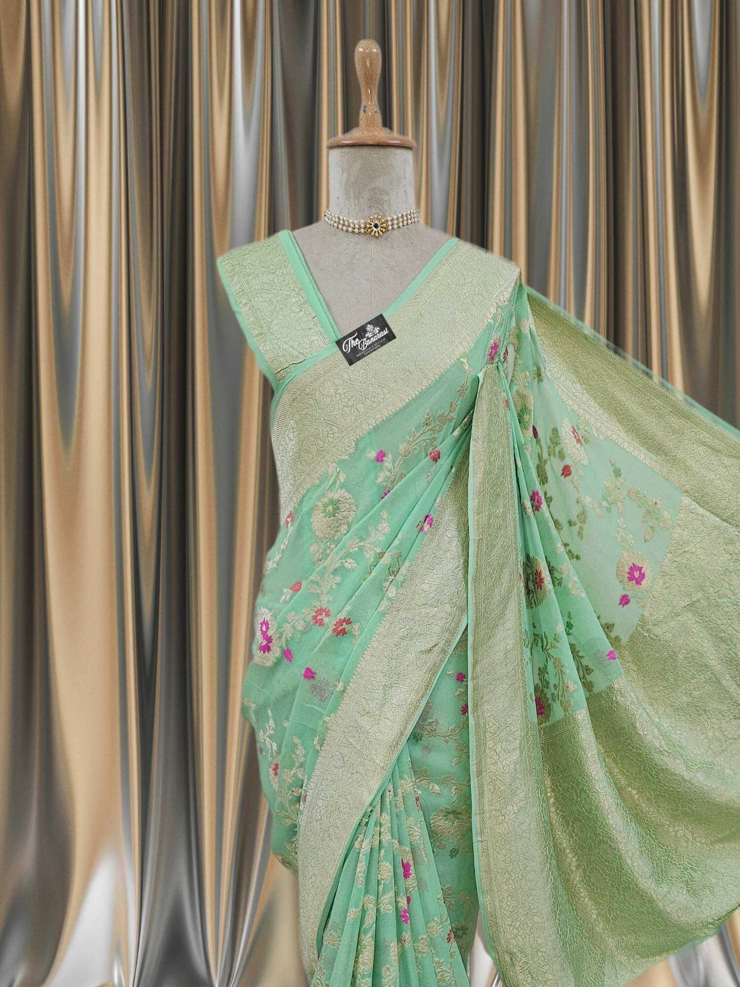 Close-up of Tea Green Handwoven Traditional Khaddi Georgette Banarasi Saree with Meenakari Design