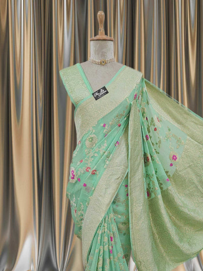 Close-up of Tea Green Handwoven Traditional Khaddi Georgette Banarasi Saree with Meenakari Design