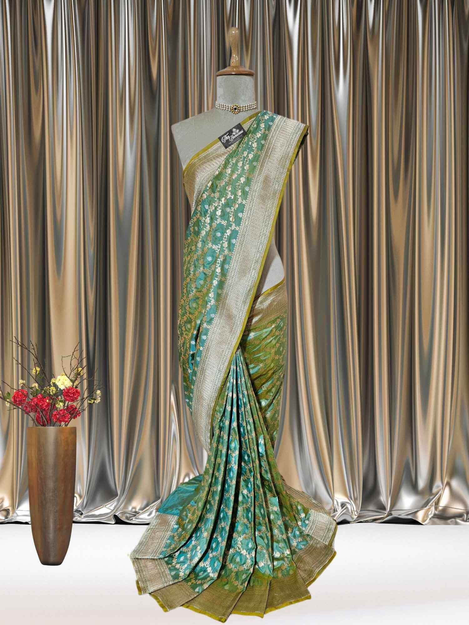 Mannequin wearing Umber Green Katan Silk Handwoven Banarasi Saree with Sona Roopa Work - Full View