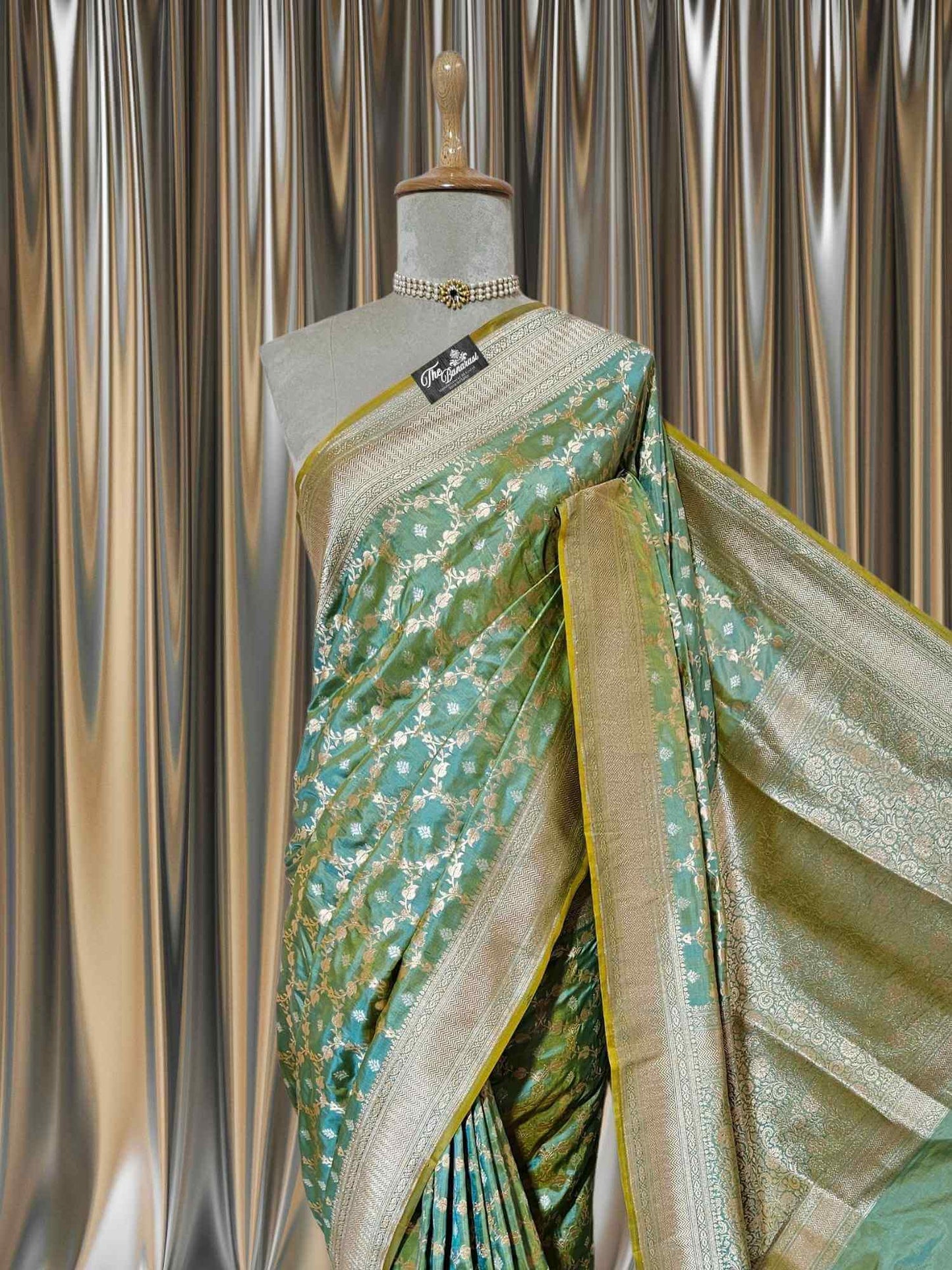 Close-up of Umber Green Katan Silk Handwoven Banarasi Saree with Sona Roopa Work