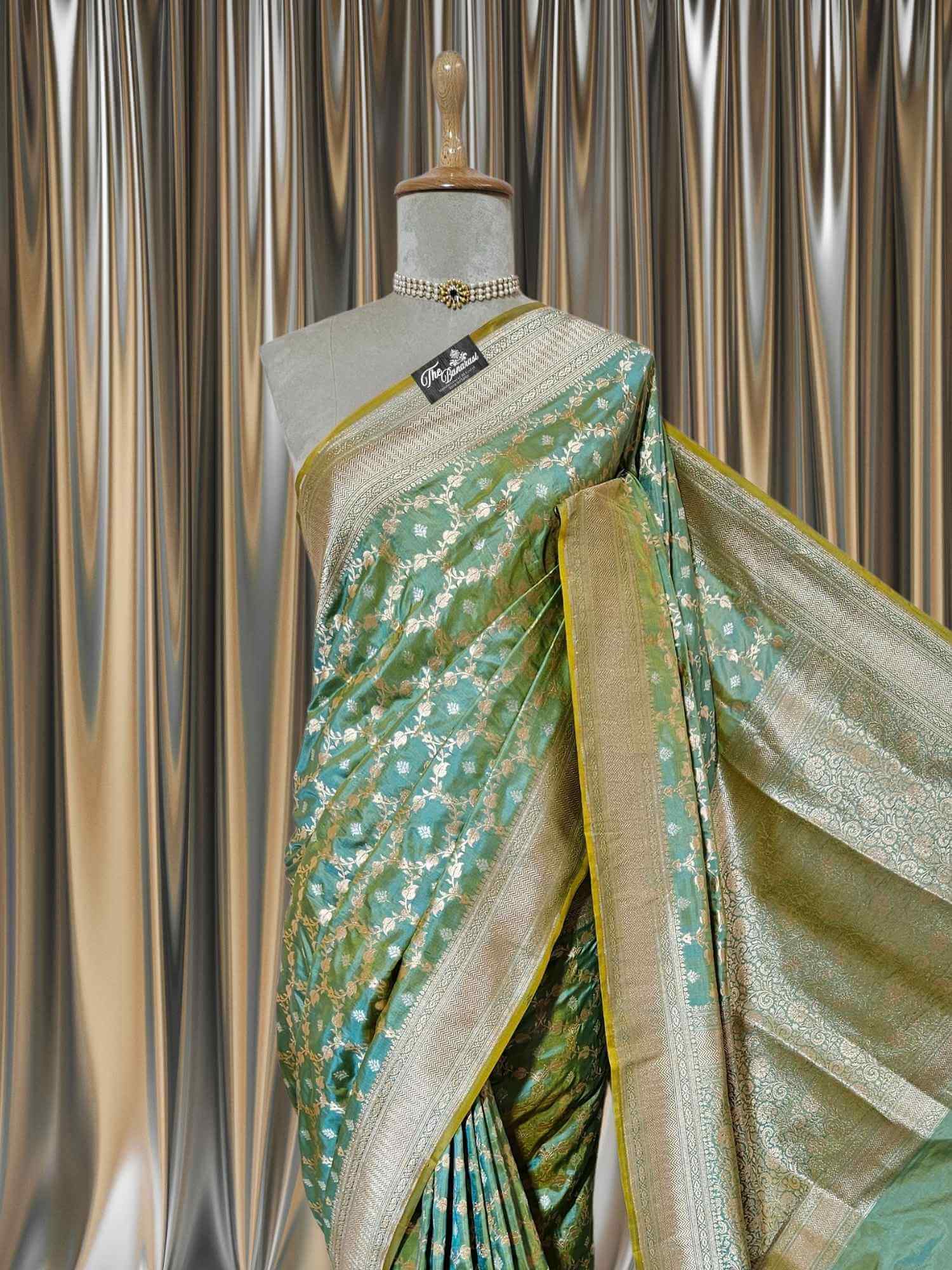 Close-up of Umber Green Katan Silk Handwoven Banarasi Saree with Sona Roopa Work