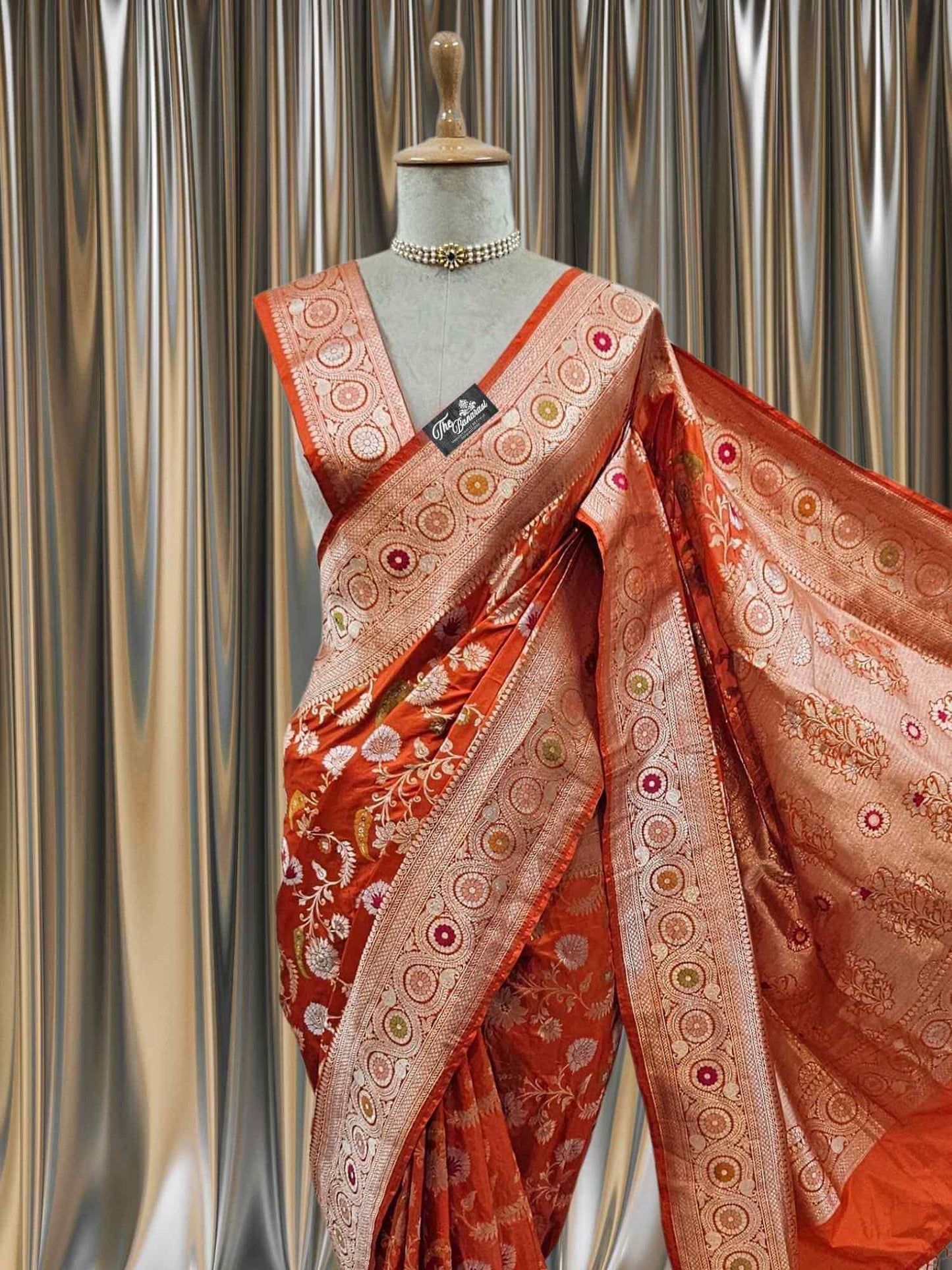 Close-up of Orange Katan Silk Handwoven Banarasi Saree with Meenakari Design