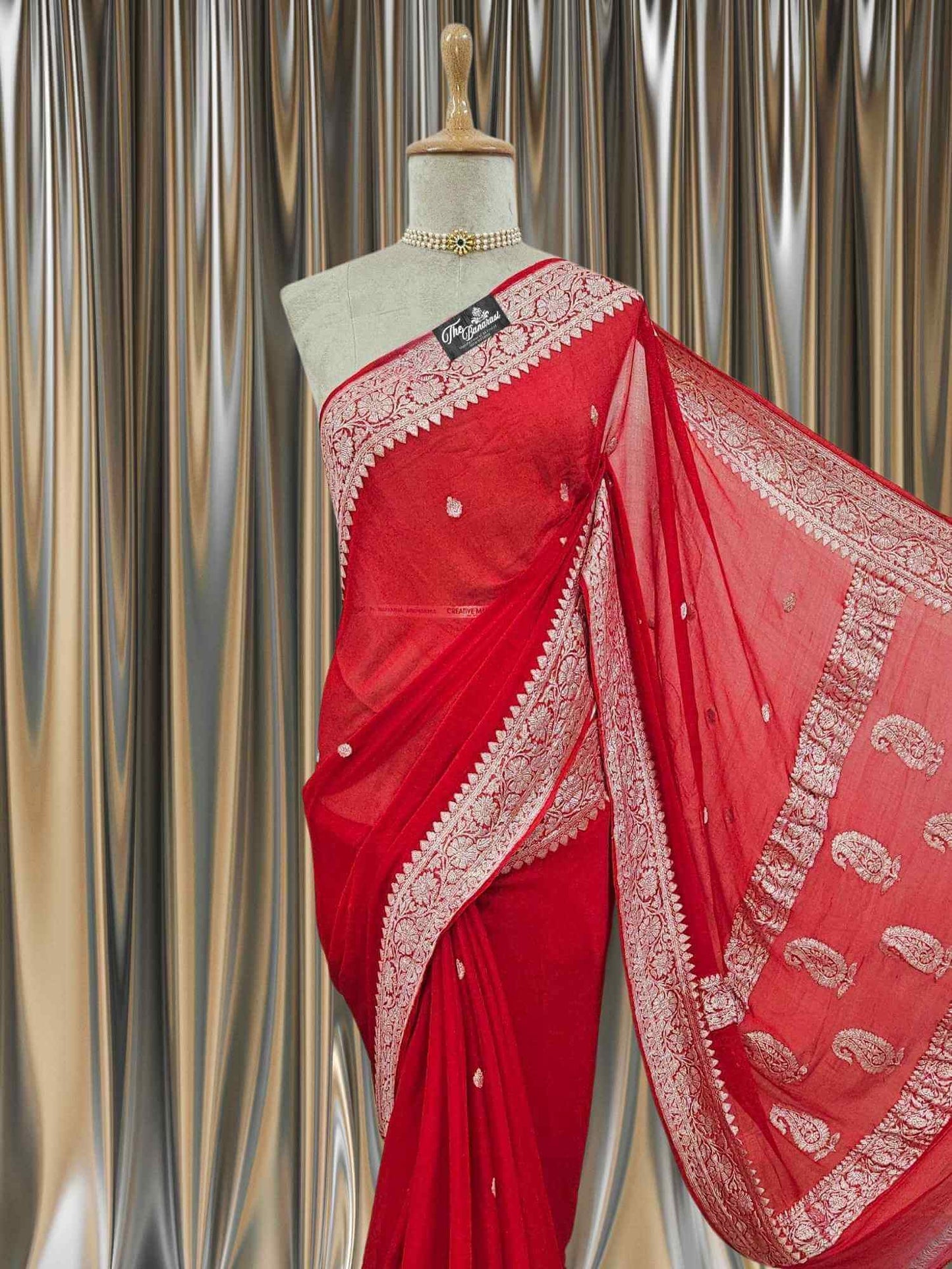 Close-up of Elegant Red Handcrafted Khaddi Georgette Banarasi Saree with Silver Zari Work