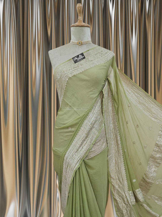 Close-up of Elegant Mehndi Green Handcrafted Khaddi Georgette Banarasi Saree with Silver Zari Work