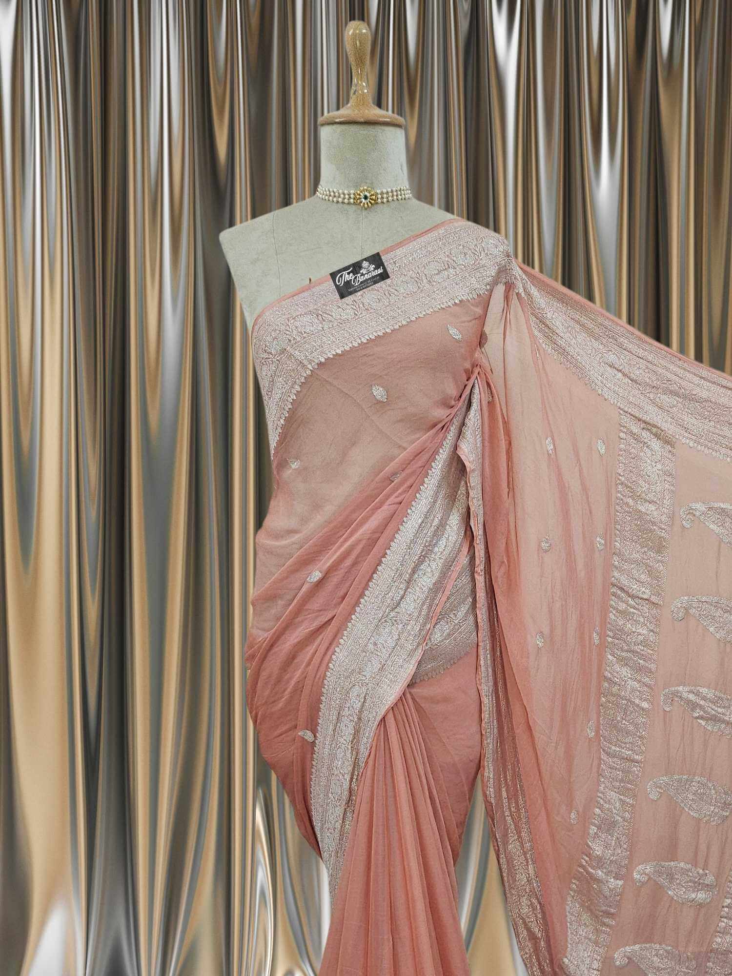 Close-up of Elegant Peach Handcrafted Khaddi Georgette Banarasi Saree with Silver Zari Work