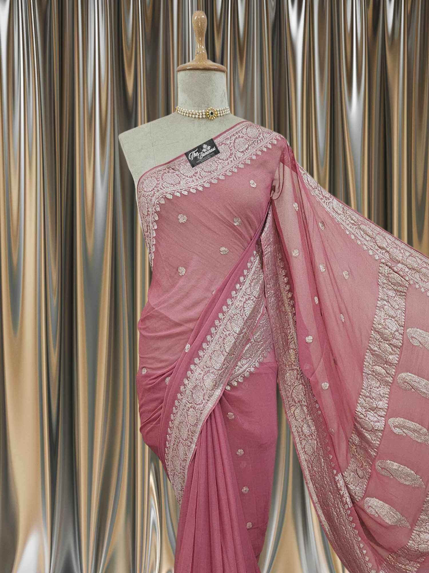 Close-up of Elegant Rouge Pink Handcrafted Khaddi Georgette Banarasi Saree with Silver Zari Work