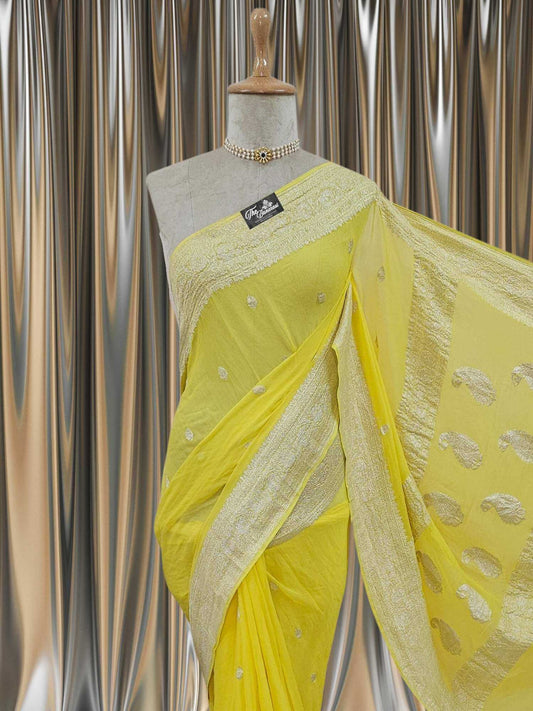 Close-up of Elegant Canary Yellow Handcrafted Khaddi Georgette Banarasi Saree with Silver Zari Work