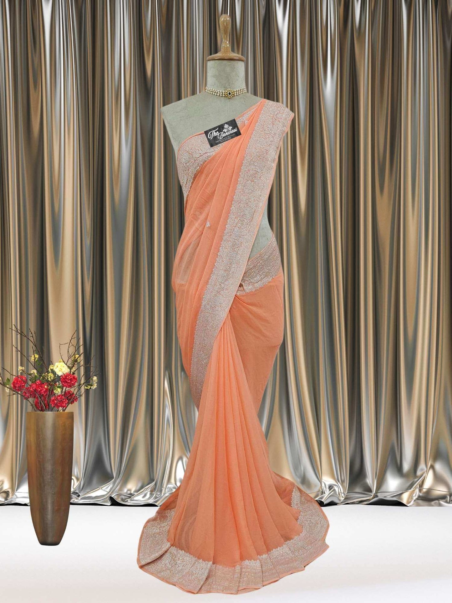 Mannequin wearing Elegant Apricot Orange Handcrafted Khaddi Georgette Banarasi Saree with Silver Zari Work - Full View