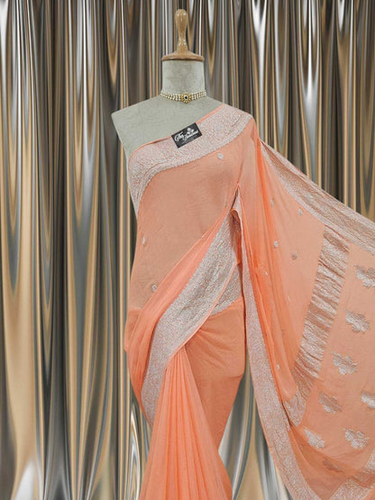 Close-up of Elegant Apricot Orange Handcrafted Khaddi Georgette Banarasi Saree with Silver Zari Work