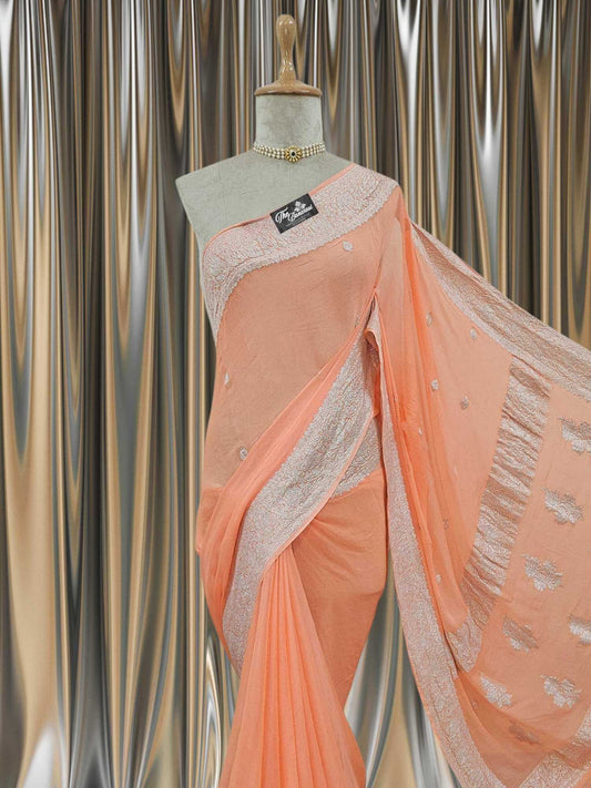 Close-up of Elegant Apricot Orange Handcrafted Khaddi Georgette Banarasi Saree with Silver Zari Work
