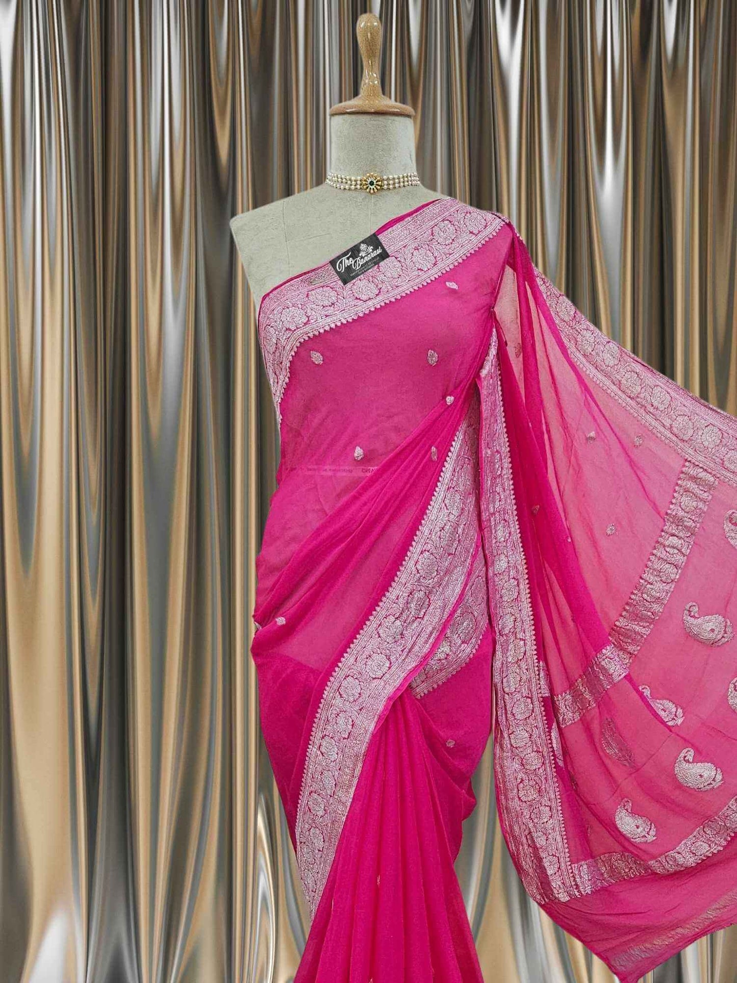 Close-up of Elegant Bright Pink Handcrafted Khaddi Georgette Banarasi Saree with Silver Zari Work