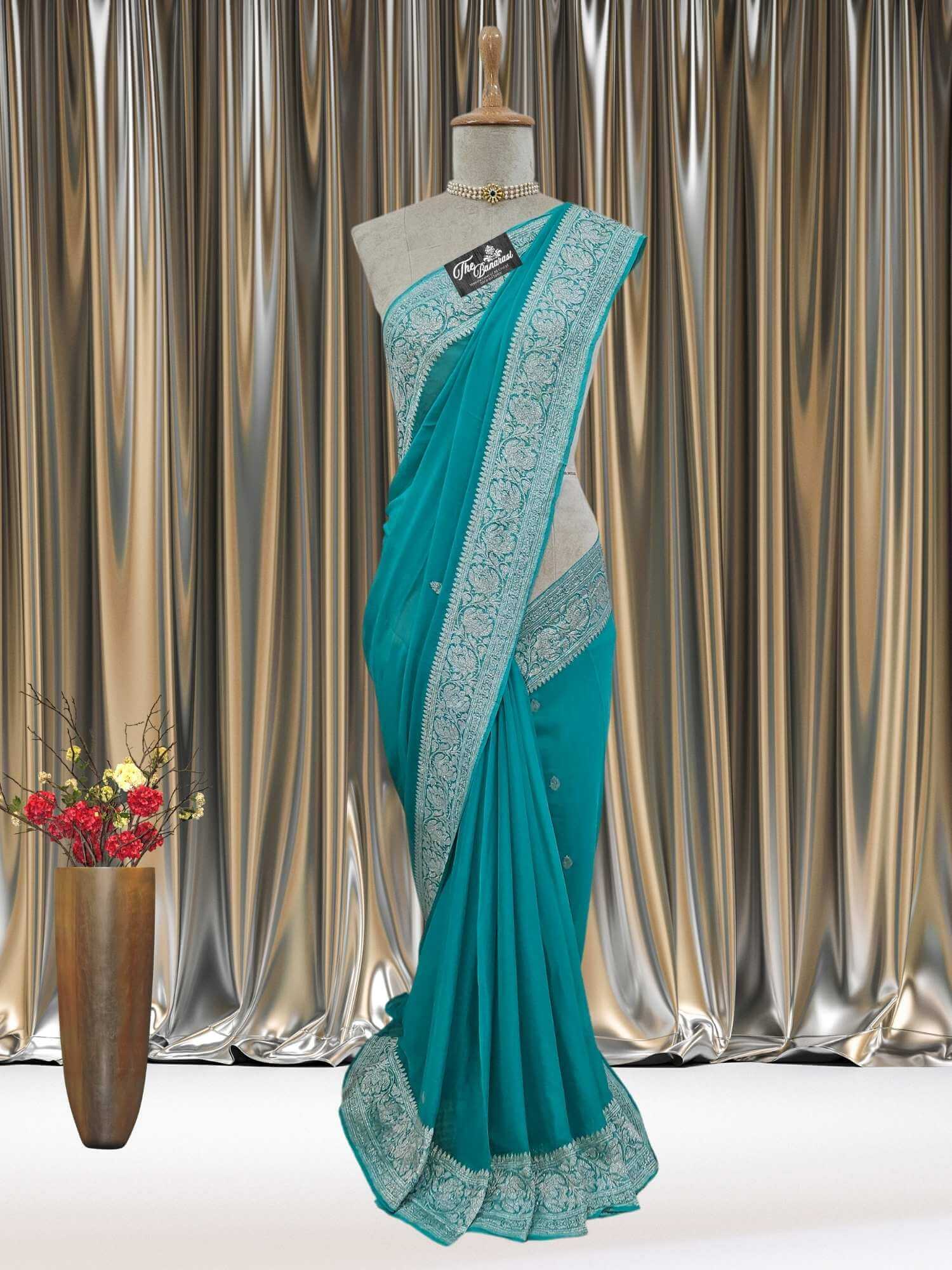 Mannequin wearing Elegant Sky Blue Handcrafted Khaddi Georgette Banarasi Saree with Silver Zari Work - Full View