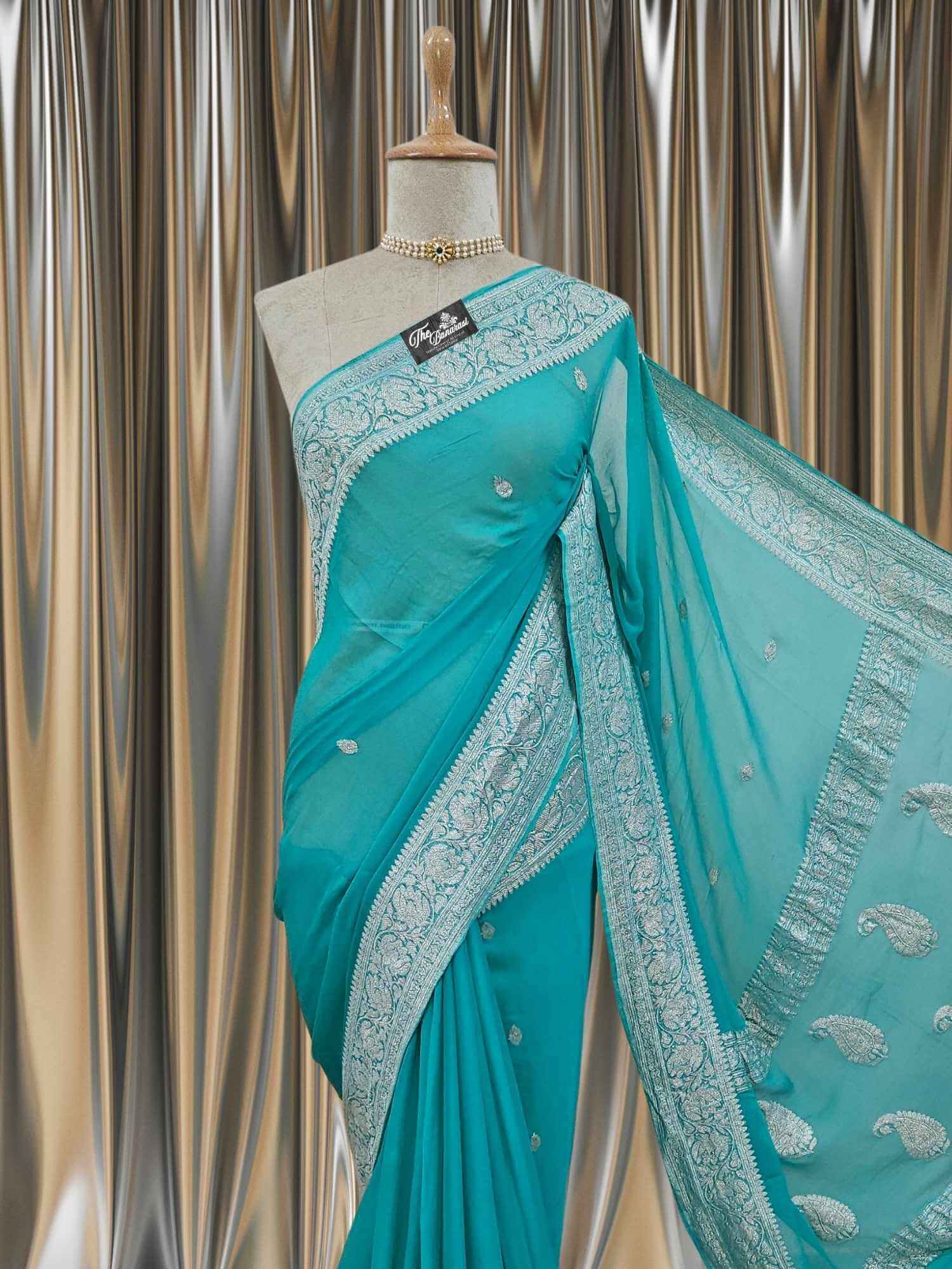 Close-up of Elegant Sky Blue Handcrafted Khaddi Georgette Banarasi Saree with Silver Zari Work