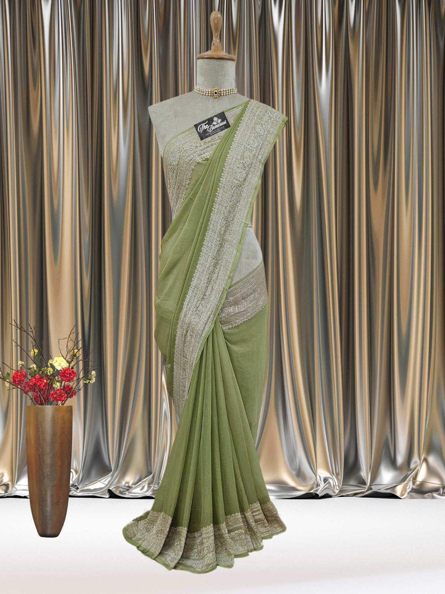 Mannequin wearing Elegant Mehndi Green Handcrafted Khaddi Georgette Banarasi Saree with Silver Zari Work - Full View